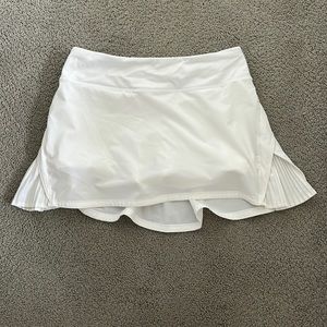 White lululemon tennis skirt. Zipper on back. Built in shorts.